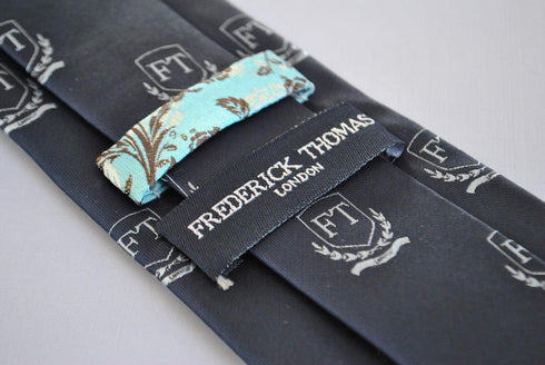 navy tie with Frederick Thomas crest design
